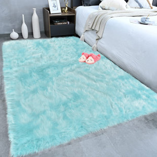 EVERLY QUINN Kovanic Solid Color Handmade Faux Sheepskin Area Rug in Light Blue