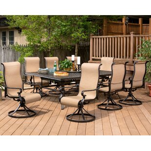 BRAYDEN STUDIO® Sweeten 9 Piece Dining Set with 8 Swivel Rocker Chairs and 60 x 84 in. Table