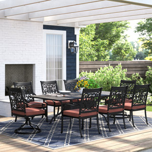 THREE POSTS™ Caseyville 9-Piece Patio Dining Set (with 2 Swivel Rockers) with Cushions and 42 x 84" Rectangular Dining Table