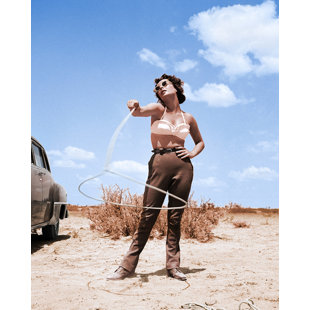 GLOBE PHOTOS ENTERTAINMENT & MEDIA " Elizabeth Taylor With Lasso " by Globe Photo Archives