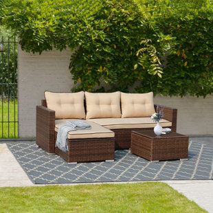 EBERN DESIGNS Cromford 3 Piece Rattan Sectional Seating Group with Cushions