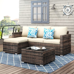 EBERN DESIGNS Southerland 3 Piece Rattan Sectional Seating Group with Cushions