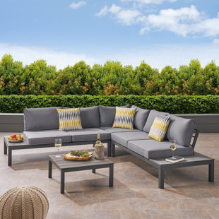 EBERN DESIGNS 4 Piece Sectional Seating Group with Cushions