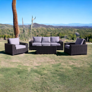COURTYARD CASUAL FURNITURE 4 Piece Rattan Sofa Seating Group with Cushions