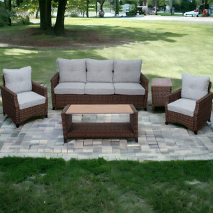 COURTYARD CASUAL FURNITURE 5 Piece Rattan Sofa Seating Group with Cushions