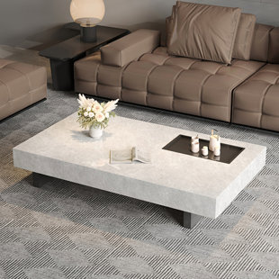 CREATURE B COMFORTS Simple rectangular rock slab floating coffee table