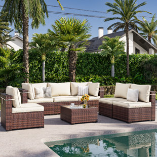 WADE LOGAN® Bhairavi 7 Piece Rattan Sectional Seating Group with Cushions