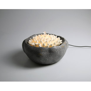 AM-DESIGN FLORISTIK GMBH Brunnen aus Stein mit Licht