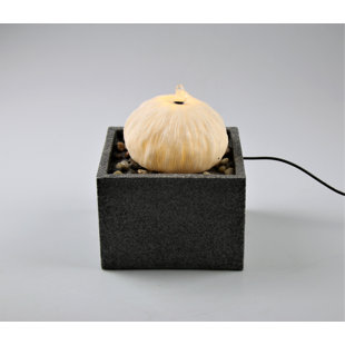 AM-DESIGN FLORISTIK GMBH Brunnen aus Stein mit Licht