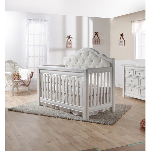 white upholstered crib