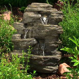 Outdoor Fountains You Ll Love Wayfair Vargas Polystone Rock Falls Outdoor Waterfall Fountain With Led Light