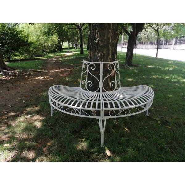 metal bench around tree