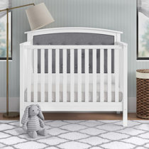 grey tufted crib
