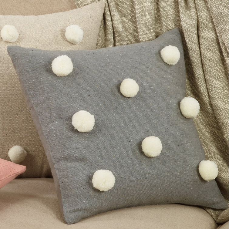 gray pom pom pillow
