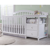 white crib with attached changing table