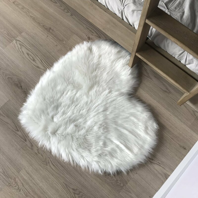 white fur throws and cushions
