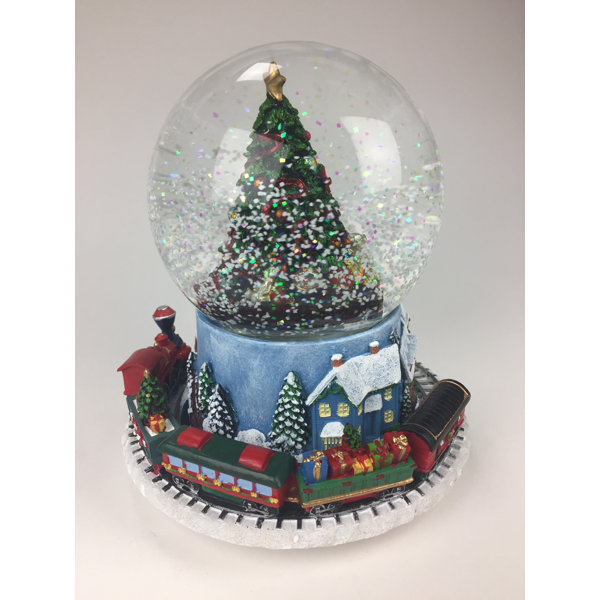 Large musical snow globe with santa on a sleigh and a moving train The Holiday Aisle® Snow Globe with Train | Wayfair