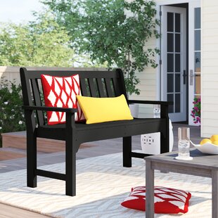 small outdoor bench with cushion