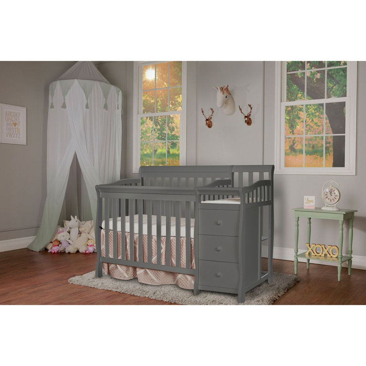 gray crib and changing table