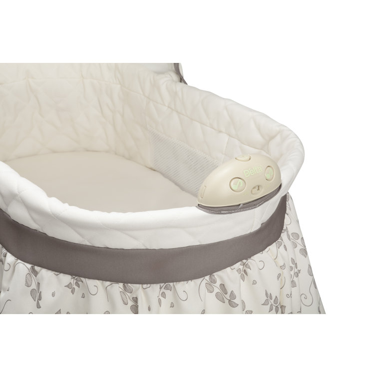 delta bassinet green and white