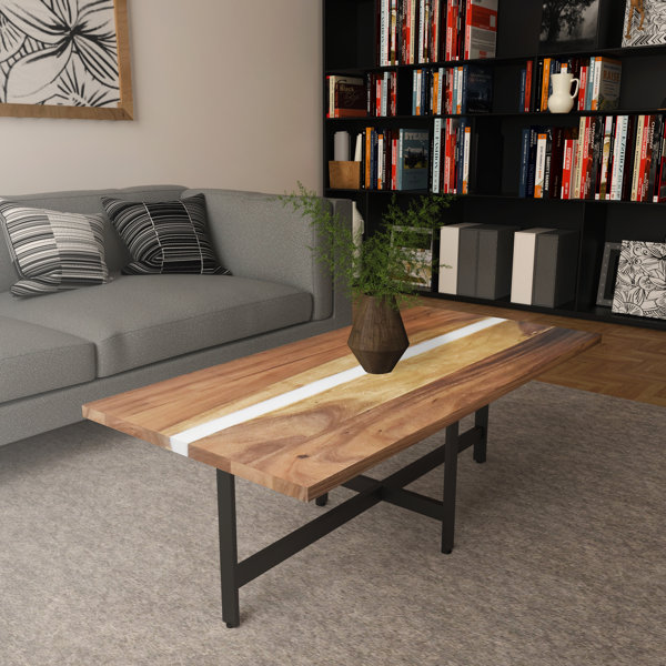 light wood coffee table with black legs