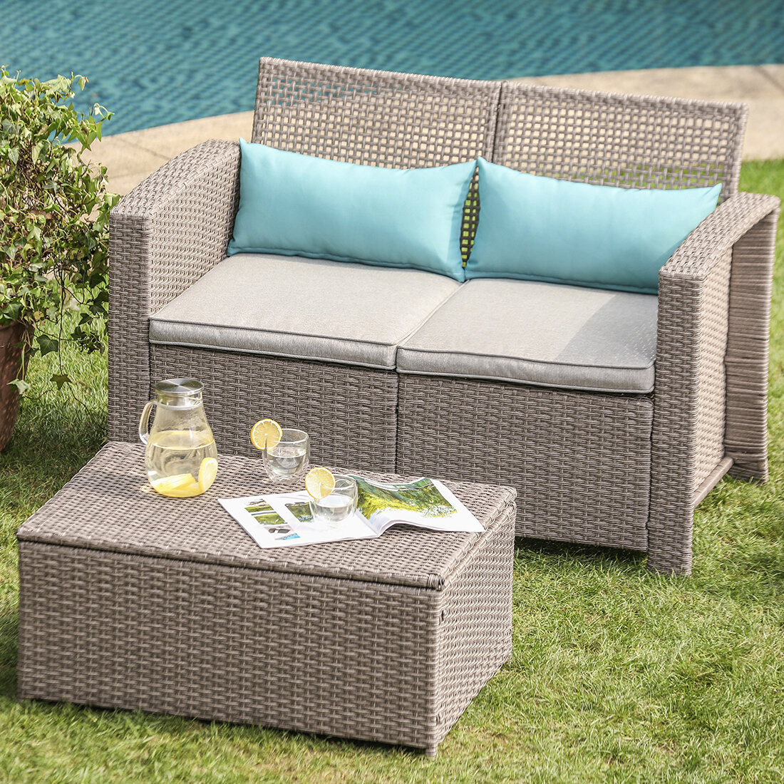 Highland Dunes Gosnell 2 Piece Outdoor Patio Furniture Taupe Open Weave Wicker Love Seat W Warm Gray Cushions Storage Chest 2 Turquoise Lumbar Pillows Wayfair