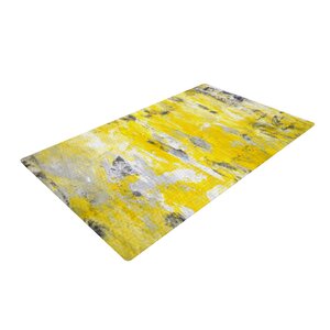 CarolLynn Tice Picking Around Yellow Area Rug