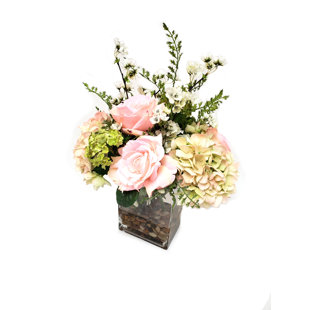 artificial flowers in glass vase