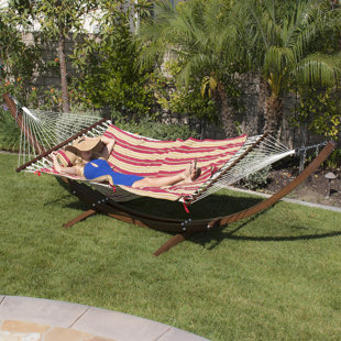 Go to store & view more images Willing Wooden Curved Arc Hammock with Stand by Loon Peak