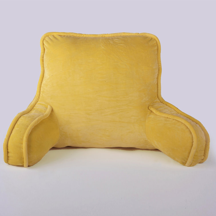 yellow bed rest pillow