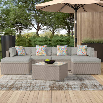 Wrought Studio Silkeborg 6 Piece Outdoor Furniture Set Warm Gray Wicker Sectional Sofa W Thick Cushions Glass Coffee Table 1 Ottoman 4 Floral Fantasy Pillows Reviews Wayfair