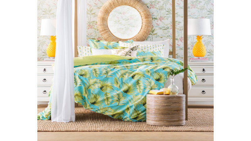 bed with tropical bedspread