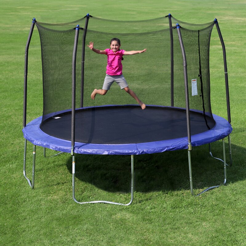 A little girl jumping on a Round Skywalker Trampoline.