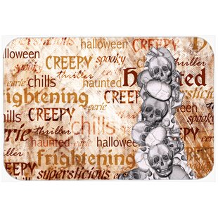 Creepy, Haunted And Frightful With Skulls Halloween Kitchen/Bath Mat By Caroline's Treasures