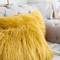 gold furry pillow