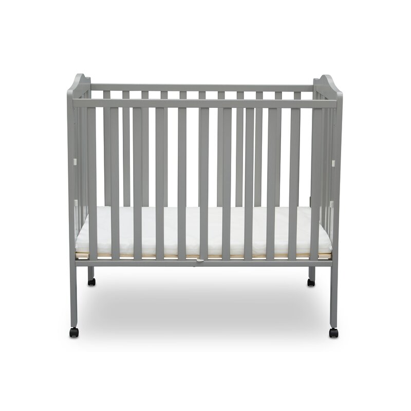 fold up mini crib