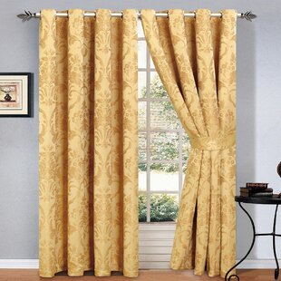 ruby-jacquard-eyelet-room-darkening-panel-curtains.jpg