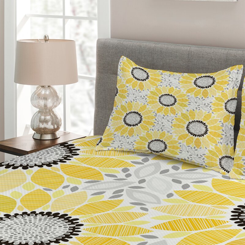 grey and yellow coverlet