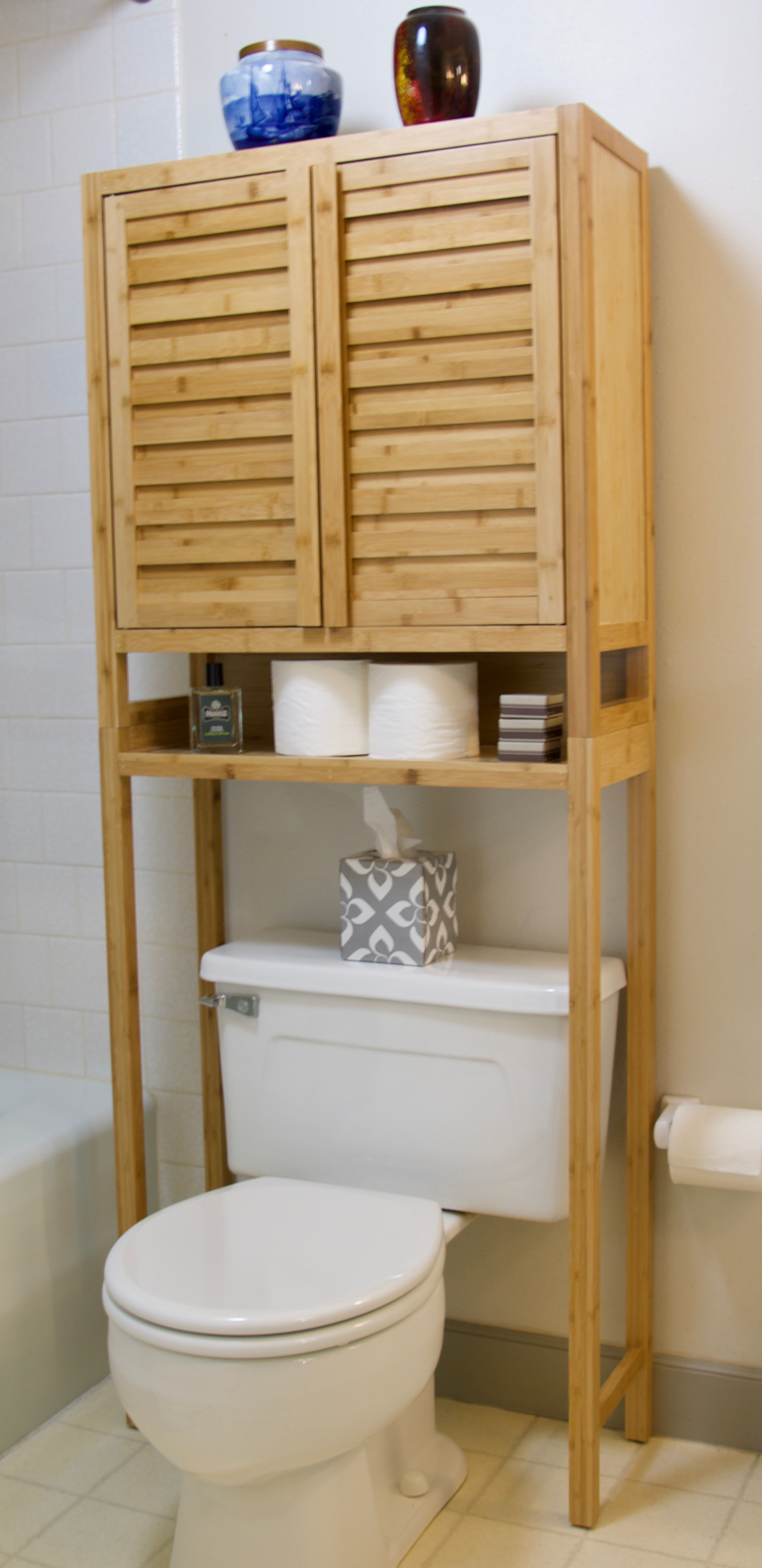 Over the toilet storage in natural wood Over the toilet storage in natural wood