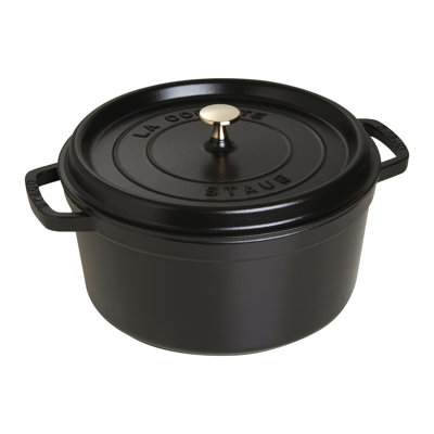 Black enamelled round cast iron cocotte with a heavy fitted lid