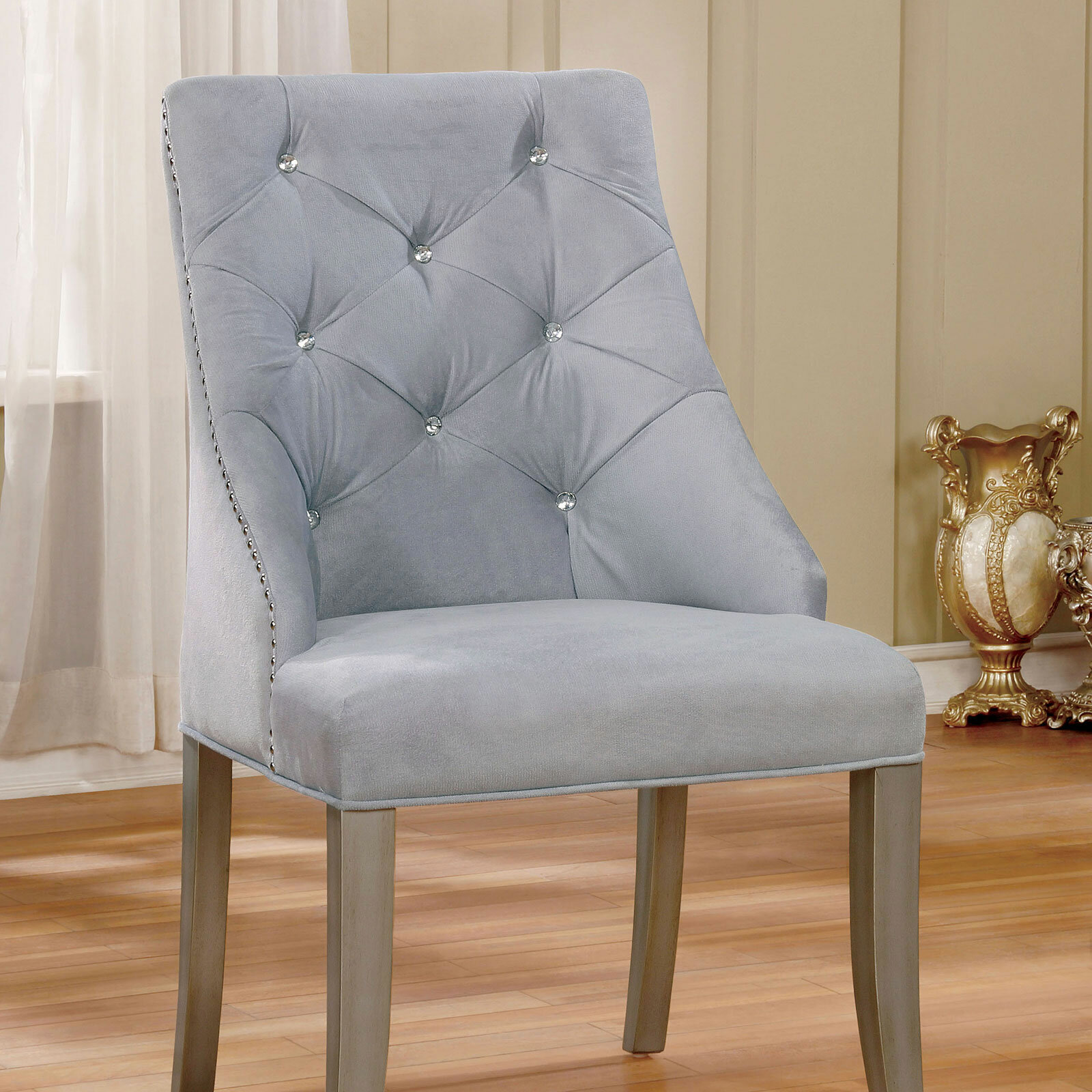 light gray tufted chair