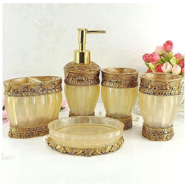 5 piece plastic bath accessory set in ivory/gold which includes wastebasket... 