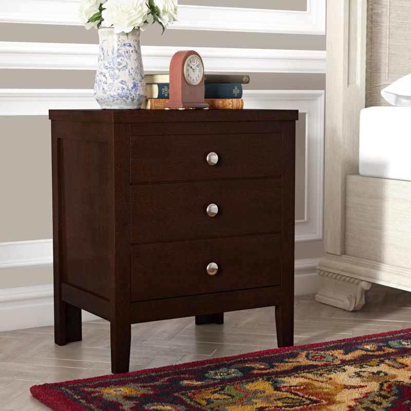 These units work well with beds on platforms, and are still easier to reach for night or morning time essentials. conrad 3 drawer solid wood nightstand in dark brown with a hint of red