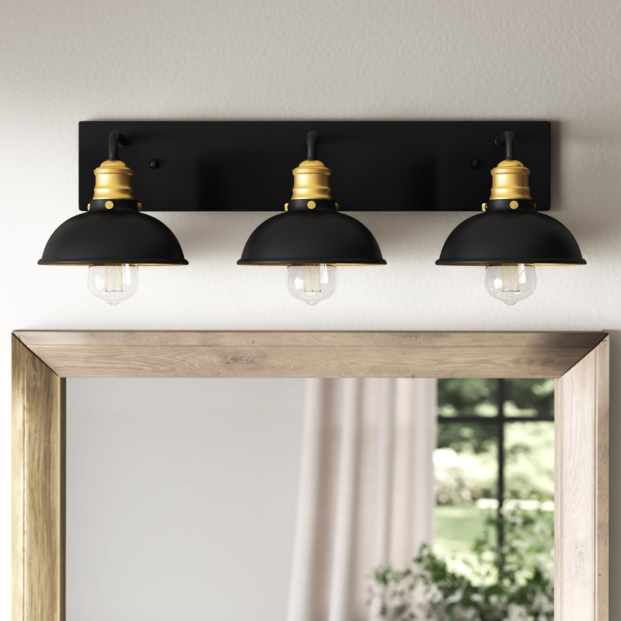 brass and black vanity light