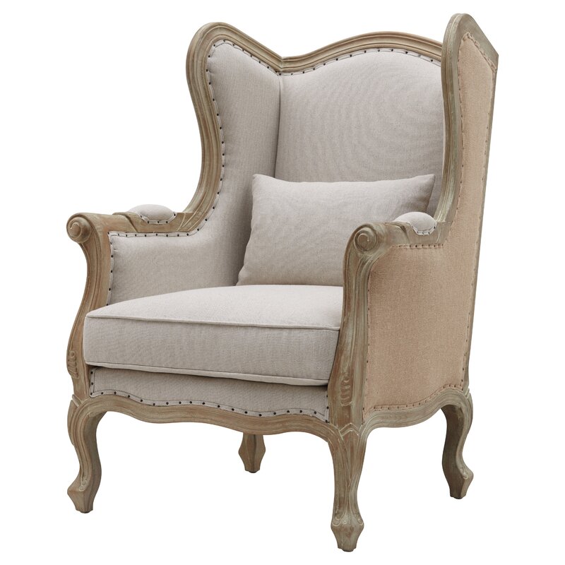 Lorinda Wingback Chair - a lovely French country inspired armchair with rustic and elegant design details. #wingchair #wingback #armchairs #furniture #livingroom #chairs #frenchcountry