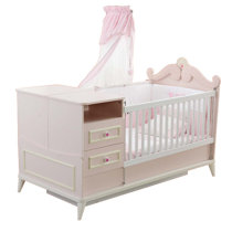 pink crib with changing table