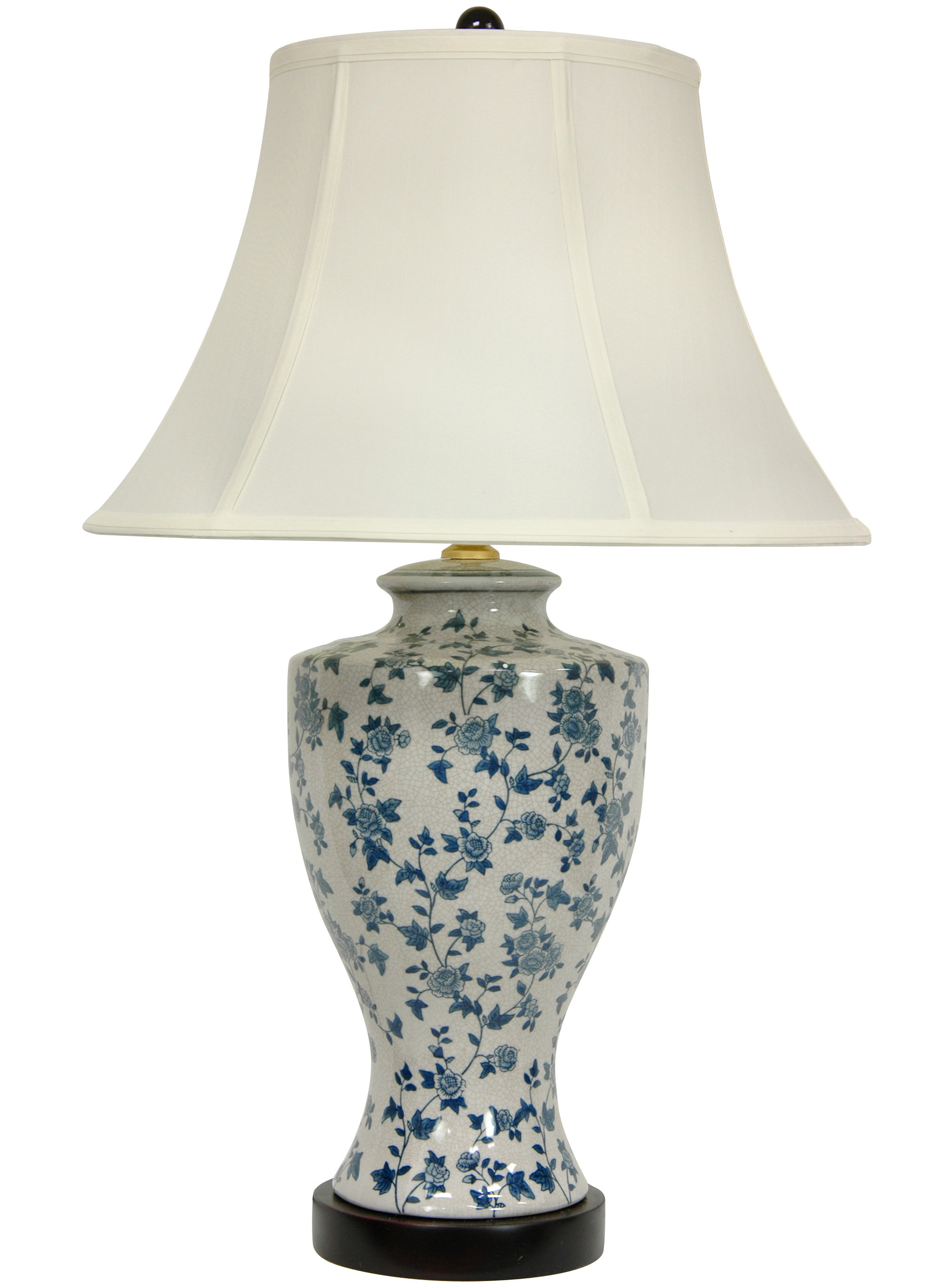 white ceramic lamp with flower on base