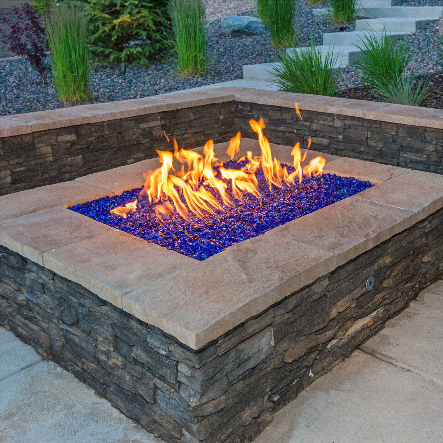 10 Best Outdoor Fire Pit Ideas to DIY or Buy: Fire Pit With Lava Rocks
