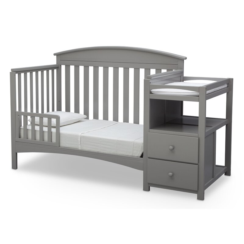 dark wood crib with changing table