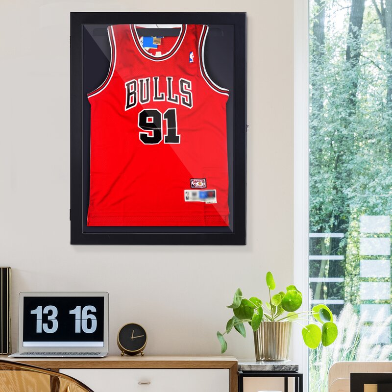 displaying jerseys on a wall